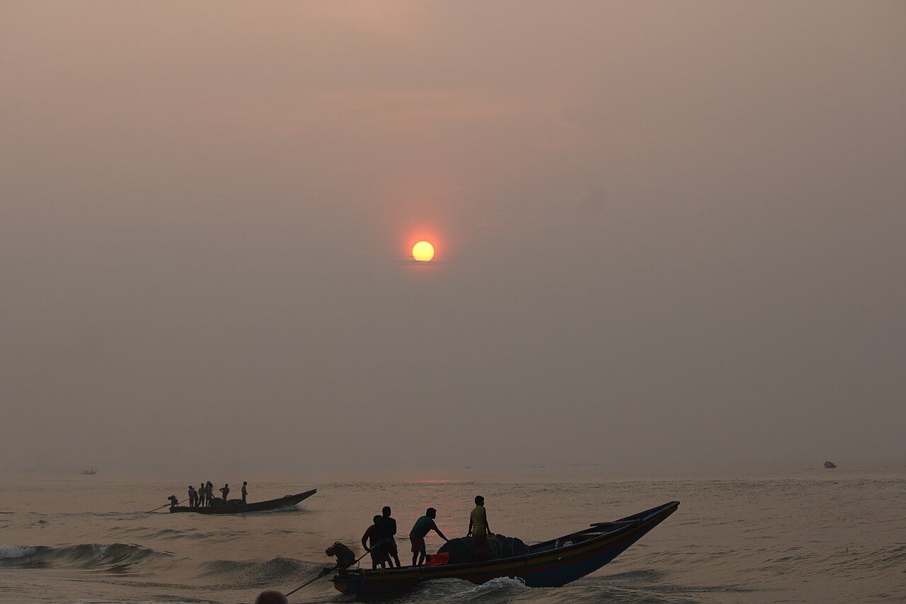 Sunrise and fishing boats at Puri Beach in Odisha